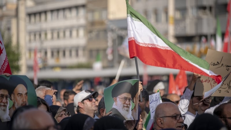 Iranian protesters in Tehran hold a portrait of Ayatollah Ali Khamenei while condemning US attacks on Iran's nuclear facilities