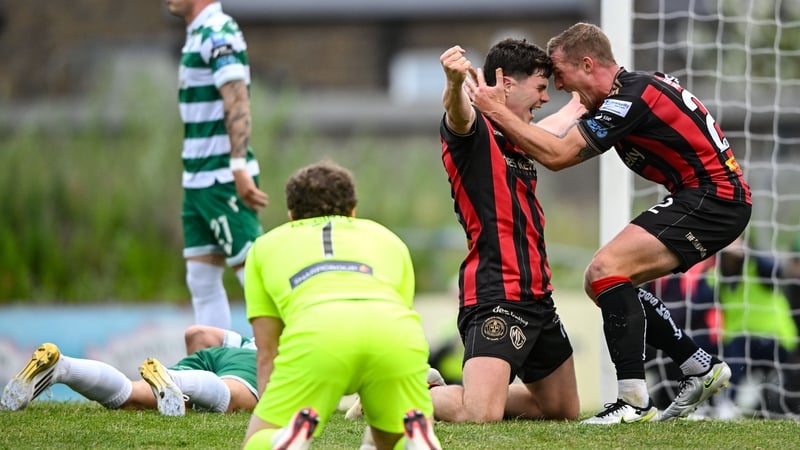 James Clarke of Bohemians, centre, celebrates with teammate John Mountney after scoring his side's second goal