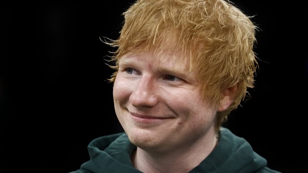 BOSTON, MA - MAY 23: English singer and songwriter Ed Sheeran smiles on the court before Game 2 of the Eastern Conference Final between the Boston Celtics and the Indiana Pacers at TD Garden on May 23, 2024 in Boston, Massachusetts. NOTE TO USER: User exp