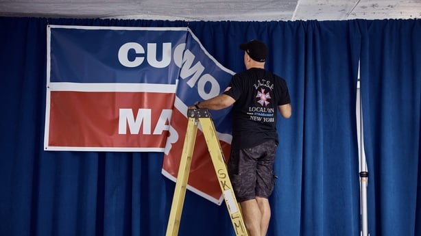 NEW YORK, NEW YORK - JUNE 24: A worker removes a sign as he dismantles the stage following New York City mayoral candidate Andrew Cuomo's election-night watch party for the Democratic primary on June 24, 2025 in New York City. Assemblyman Zohran Mamdani and Cuomo were leading the vote, but the city'
