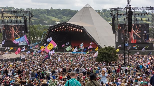 GLASTONBURY, ENGLAND - JUNE 30: People gather in front of the main Pyramid Stage during day five of Glastonbury Festival 2024 at Worthy Farm, Pilton on June 30, 2024 in Glastonbury, England. Founded by Michael Eavis in 1970, Glastonbury Festival features around 3,000 performances across over 80 stag
