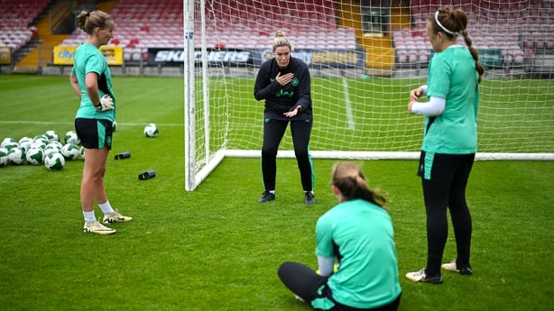 1 June 2025; Goalkeeping coach Emma Byrne speaks to goalkeepers, from left, Sophie Whitehouse, Courtney Brosnan and Grace Moloney during a Republic of Ireland women's training session at Turner's Cross in Cork. Photo by Stephen McCarthy/Sportsfile