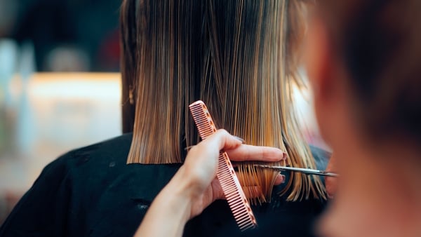 Professional beauty salon worker executing perfect ends trimming