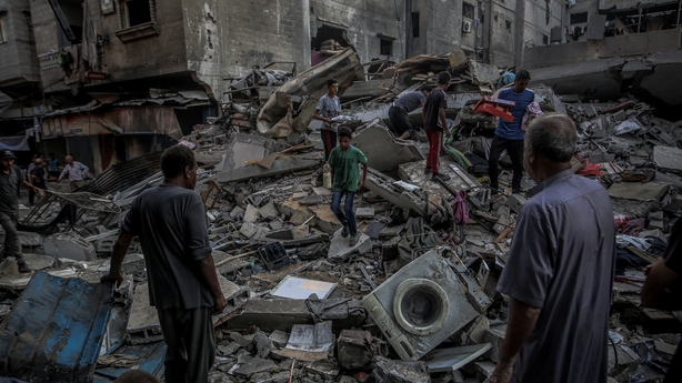 GAZA CITY, GAZA - JUNE 26: Palestinians search for usable items in the rubble of heavily damaged and collapsed buildings after Israeli attacks on Al-Shati refugee camp in Gaza City, Gaza on June 26, 2025. Many buildings have been destroyed following an attack by the Israeli army on the Al-Shati Refu