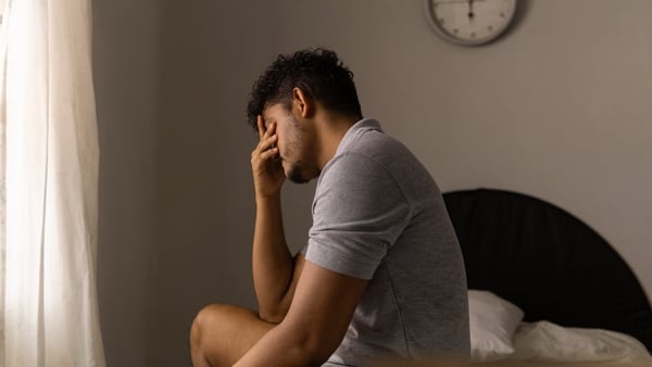 Tired man just woke up. Concept of low energy and sleeplessness.