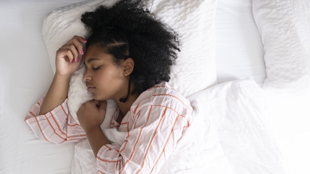 Young woman in bed