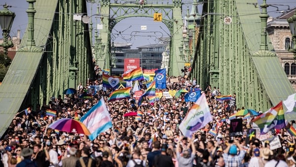 Demonstrators march on Liberty Bridge during the annual Pride parade in Budapest, Hungary, on Saturday, July 24, 2021. Brussels is threatening action over an LGBTQ law that could involve cutting funds to Budapest; Prime Minister Viktor Orban has proposed