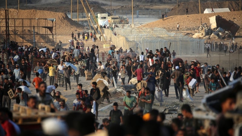 Palestinians gather near an aid site run by the US- and Israeli-backed Gaza Humanitarian Foundation in Nuseirat in Gaza last month