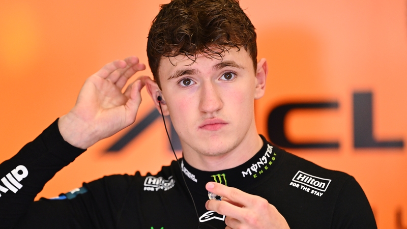 Alex Dunne looking on in the garage during practice