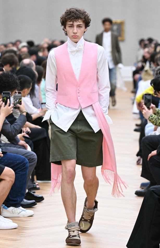 a person in a pink vest and shorts