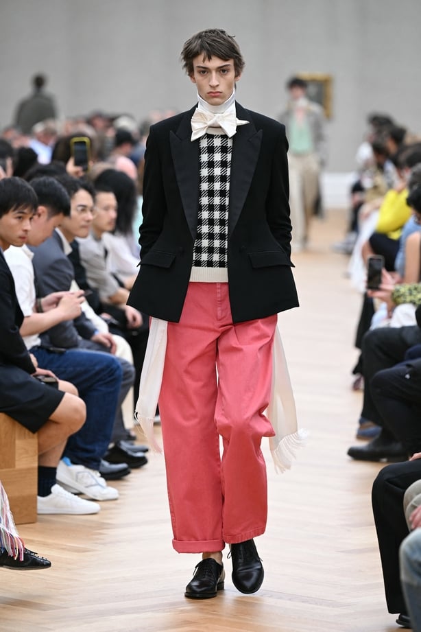 a person wearing a suit and tie