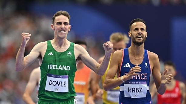 3 August 2024; Cathal Doyle of Team Ireland, left, alongside Azeddine Habz of Team France, celebrates finishing first in his men's 1500m repechage at the Stade de France during the 2024 Paris Summer Olympic Games in Paris, France. Photo by Sam Barnes/Sportsfile