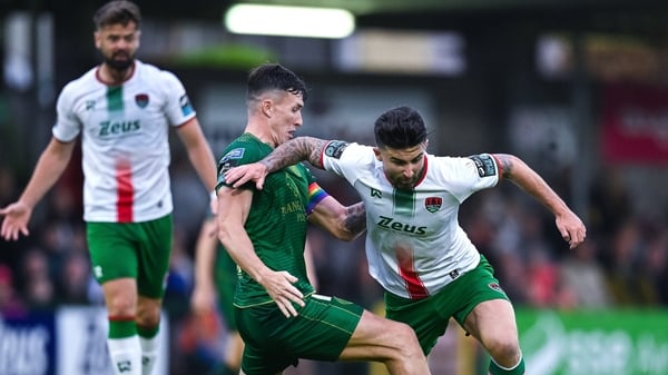 Cork City's Seani Maguire (r) is tackled by Joe Redmond during the league meeting between the sides in Turner's Cross on 27 June