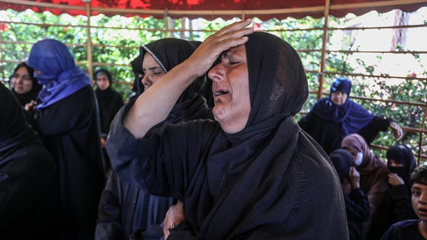 KHAN YUNIS, GAZA - JUNE 28: Relatives of the Palestinians, who died as a result of the Israeli attacks mourn as the dead bodies were taken from the Nasser Hospital for burial in Khan Yunis, Gaza on June 28, 2025. (Photo by Abed Rahim Khatib/Anadolu via Getty Images)