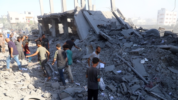 JABALIA, GAZA - JUNE 27: People investigate the area and look for their belongings among the rubble after Israeli army attacked the house of the Tumus family in Jabalia al-Baled neighborhood in the northern Gaza Strip on June 27, 2025. (Photo by Khalil Ramzi Alkahlut/Anadolu via Getty Images)