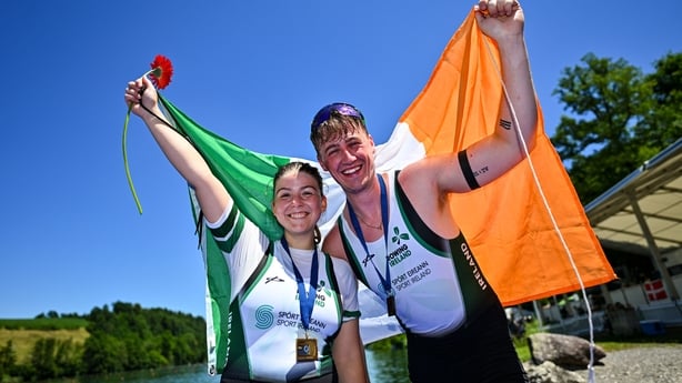 28 June 2025; Sadhbh Ní Laoghaire, left, and Tiarnán O'Donnel of Ireland with their bronze medals after the PR3 Mixed Double Sculls Final during the 2025 World Rowing Cup at Rotsee in Lucerne, Switzerland. Photo by Benedict Tufnell/Sportsfile 