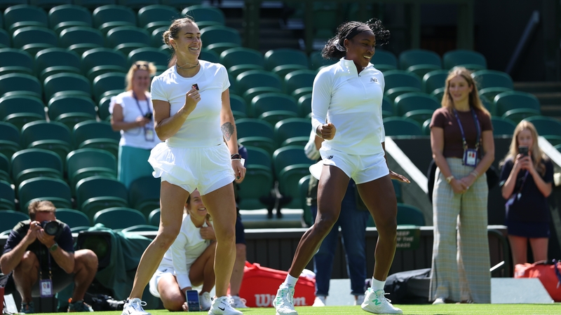 Aryna Sabalenka and Coco Gauff dance together after a practice session at Wimbledon