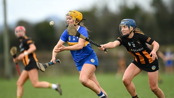 Mary Burke of Tipperary is tackled by Mary O'Connell of Kilkenny during the Very National Camogie League Division 1A match between between Tipperary and Kilkenny at The Ragg GAA Grounds in Tipperary.