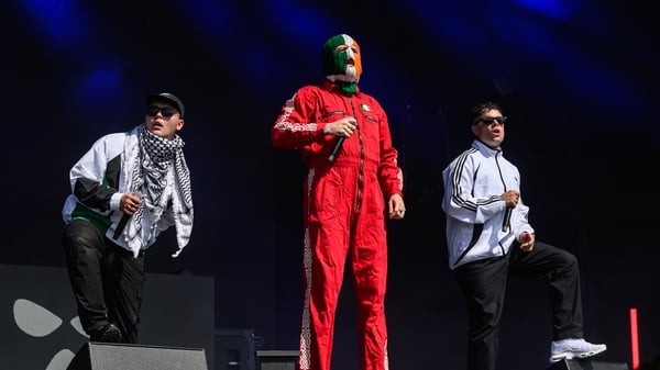 GLASTONBURY, ENGLAND - JUNE 28: Mo Chara, DJ Provaí and Móglaí Bap of Kneecap perform on the West Holts stage during day four of Glastonbury festival 2025 at Worthy Farm, Pilton on June 28, 2025 in Glastonbury, England. Established by Michael Eavis in 197