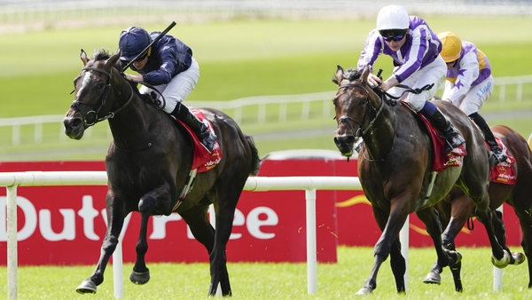 KILDARE, IRELAND - JUNE 29: Ryan Moore riding Lambourn (L, navy blue) win The Dubai Duty Free Irish Derby at Curragh Racecourse on June 29, 2025 in Kildare, Ireland. (Photo by Alan Crowhurst/Getty Images)