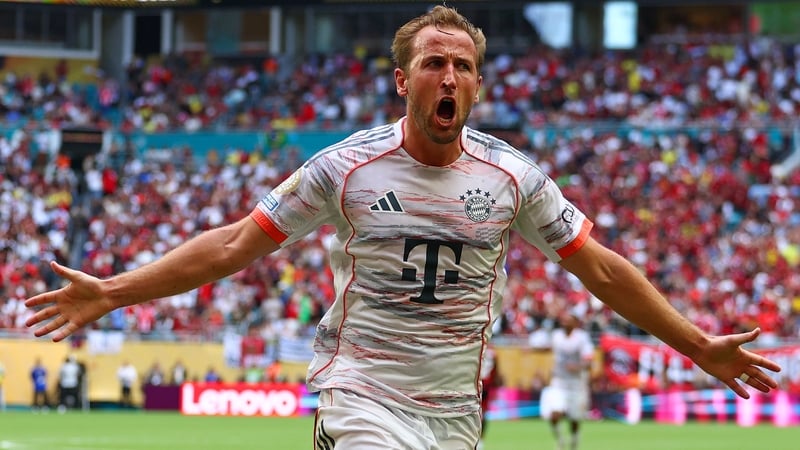 Harry Kane celebrates scoring the fourth goal in Bayern Munich's victory