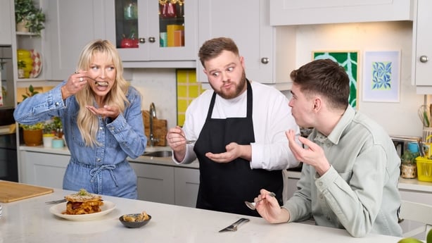 a group of people in a kitchen