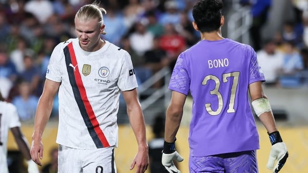Erling Haaland of Manchester City FC (L) and Yassine Bounou of Al Hilal (R) looks on during the FIFA Club World Cup