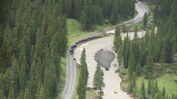 GARDINER, MONTANA - JUNE 19: Northeast Entrance Road is shown severely damaged following historic flooding in Yellowstone National Park that forced it to shut down last week, June 19, 2022 in Gardiner, Montana. Parts of the park will reopen to visitors Wednesday morning, according to published repor