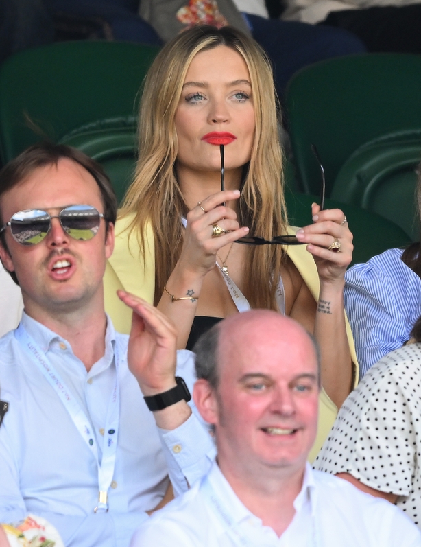 a group of people sitting in a stadium