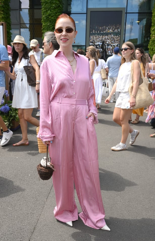 a person in a pink jumpsuit