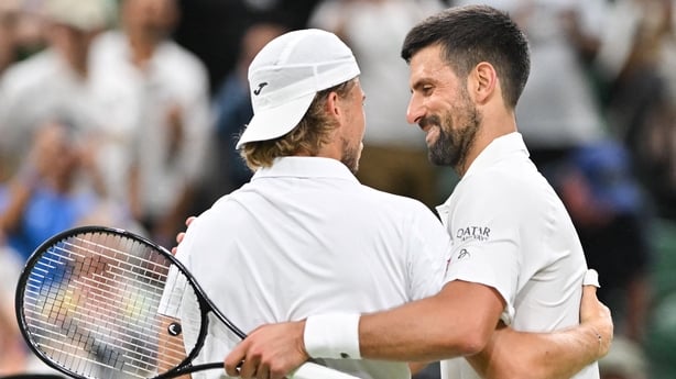 Serbia's Novak Djokovic (R) shakes hands with France's Alexandre Muller after winning their men's singles first round tennis match on the second day of the 2025 Wimbledon Championships at The All England Lawn Tennis and Croquet Club in Wimbledon, southwest London, on July 1, 2025.