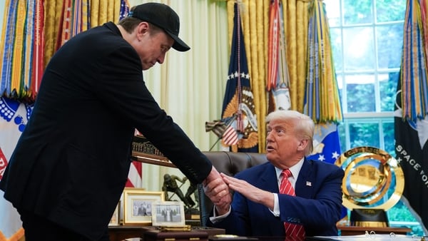 US President Donald Trump shakes hands with Elon Musk after Trump gifted him with a "key to the White House" during a news conference in the Oval Office of the White House in Washington, DC, on May 30, 2025. Musk, who stormed into US politics as President
