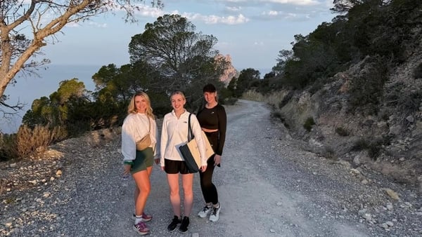 Camilla, centre, on a sunrise hike in Ibiza (Camilla Foster/PA)