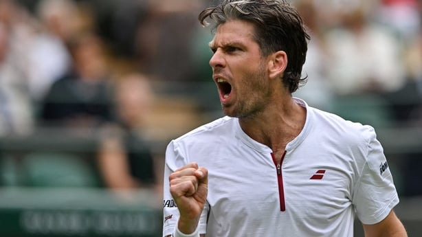 Britain's Cameron Norrie reacts as he plays against US player Frances Tiafoe during their men's singles second round tennis match on the third day of the 2025 Wimbledon Championships at The All England Lawn Tennis and Croquet Club in Wimbledon, southwest London, on July 2, 2025. 
