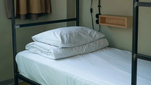 Leaba in ionad IPAS-Getty