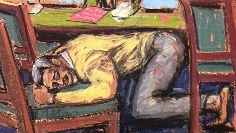 Court sketch showing Combs with his head on a chair after the verdict was announced