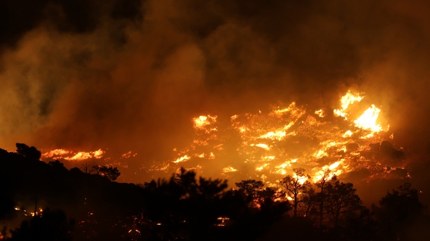CRETE, GREECE - JULY 2: 145 firefighters, 8 on-foot units and 25 vehicles work on the scene where a large wildfire broke out in Ierapetra on the Greek island of Crete on July 2, 2025. The wildfire on Crete has scorched forest land, threatened homes, and forced the evacuation of residents and tourist