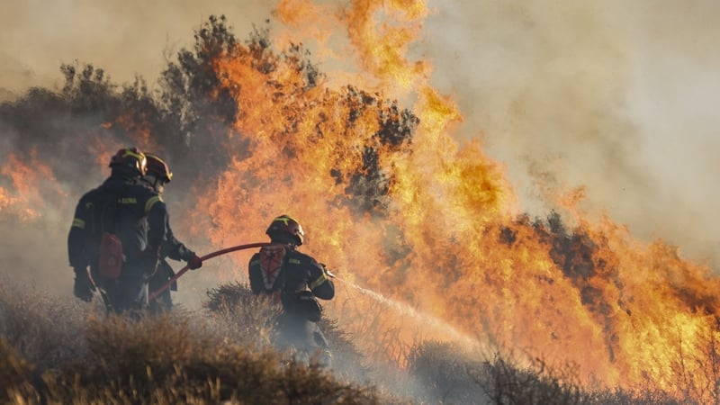 Firefighters battle a wildfire that broke out in Ierapetra on Crete