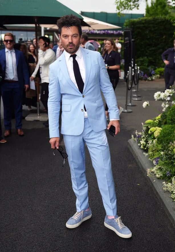 Dominic Cooper wore an all-blue suit with pink socks (Ben Whitley/PA)