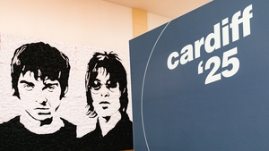 CARDIFF, WALES - JUNE 28: The "Wonder Wall" bucket hat portraits of Oasis members Noel and Liam Gallagher by Welsh artist Nathan Wyburn ahead of the band's tour of the UK on June 28, 2025 in Cardiff, Wales. (Photo by Maxine Howells/Getty Images)