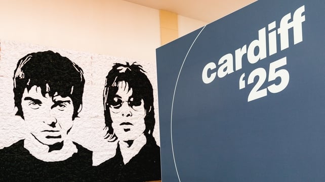 CARDIFF, WALES - JUNE 28: The "Wonder Wall" bucket hat portraits of Oasis members Noel and Liam Gallagher by Welsh artist Nathan Wyburn ahead of the band's tour of the UK on June 28, 2025 in Cardiff, Wales. (Photo by Maxine Howells/Getty Images)