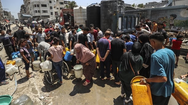 GAZA CITY, GAZA - JULY 02: Displaced Palestinians in Gaza City, Gaza try to meet their daily water needs by filling jerrycans from water delivered by tankers, on July 2, 2025. In the Gaza Strip, under Israeli attacks, Palestinians deprived of basic necessities such as shelter, food, and clean water