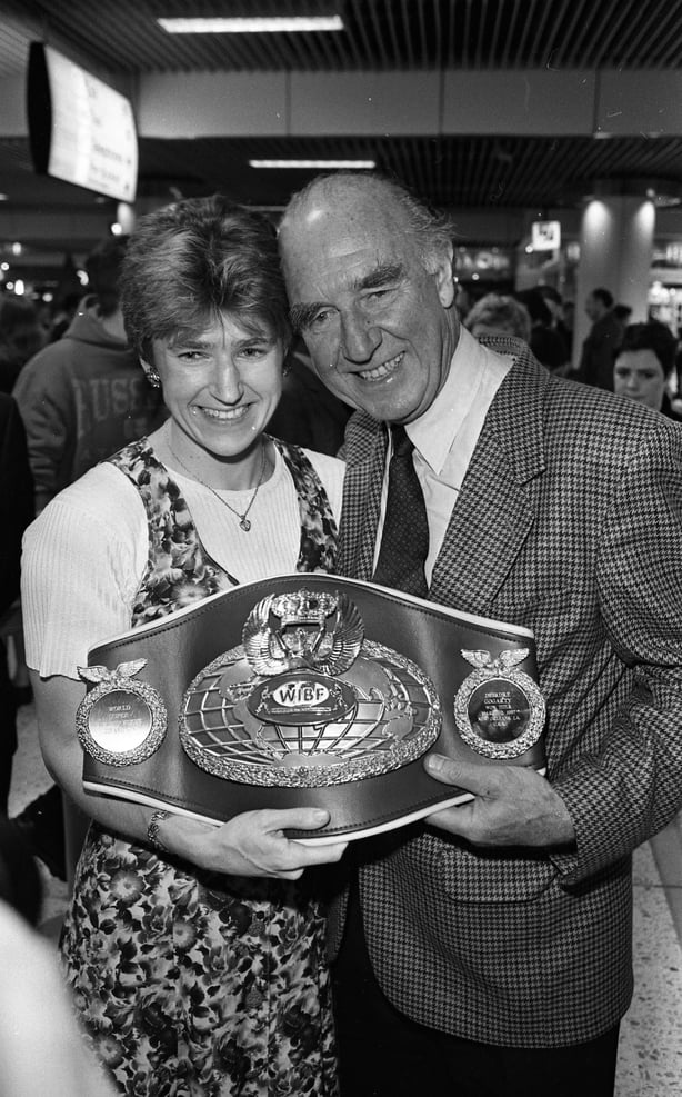 Portrait of Ireland's first Woman's World Boxing champion Deirdre Gogarty (left) holds her trophy as she poses with her father Pete at Dublin AIrport, Dublin, Ireland, May 17, 1997. (Part of the Independent Newspapers Ireland/NLI Collection) (Photo by Independent News and Media/Getty Images)