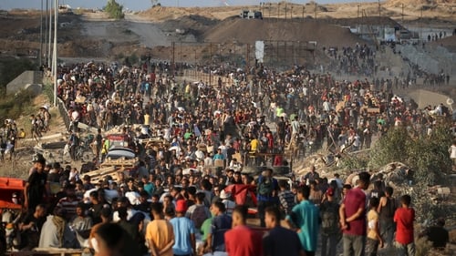 Palestinians gather at an aid distribution point set up by the privately-run Gaza Humanitarian Foundation