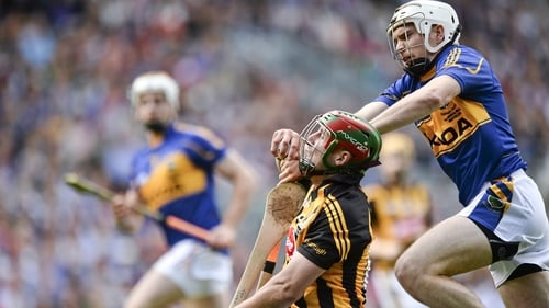 Kilkenny's Eoin Larkin is challenged by Tipperary's Brendan Maher in the 2014 All-Ireland hurling final