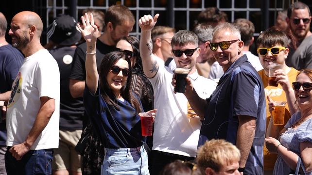 Oasis fans enjoying a drink in the Cardiff sunshine