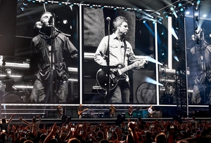 CARDIFF, WALES - JULY 04: (EDITORS NOTE: EDITORIAL USE ONLY. IMAGES MAY ONLY BE USED IN RELATION TO THE EVENT. NO COMMERCIAL USE. NO USE IN PUBLICATIONS SOLELY DEDICATED TO THE ARTIST. NO USE AFTER JULY 03, 2026.) Oasis perform on stage during the opening