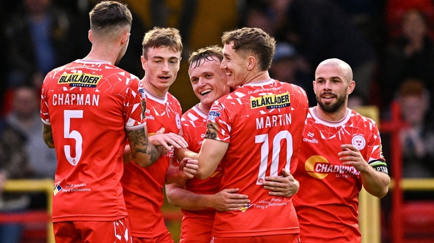 JJ Lunney, centre, celebrates with Shelbourne team-mates after scoring his side's third goal