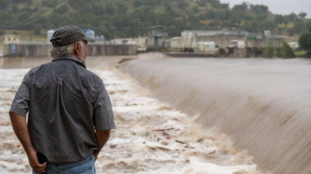 KERRVILLE, TEXAS - JULY 04: A Kerrville resident watches the rising waters of the Guadalupe River on July 4, 2025 in Kerrville, Texas. Heavy rainfall caused flooding along the Guadalupe River in central Texas with multiple fatalities reported. (Photo by Eric Vryn/Getty Images)