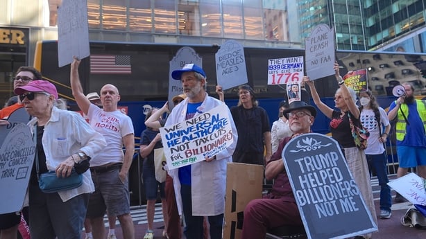 NEW YORK CITY, UNITED STATES - JULY 4: A group of Americans stage a mass 'Die-In' outside Trump Tower as President Donald Trump signs the big tax cut and spending bill into law in a July Fourth ceremony on Independence Day on Friday, July 4, 2025, in New York City, United States. (Photo by Selcuk Ac